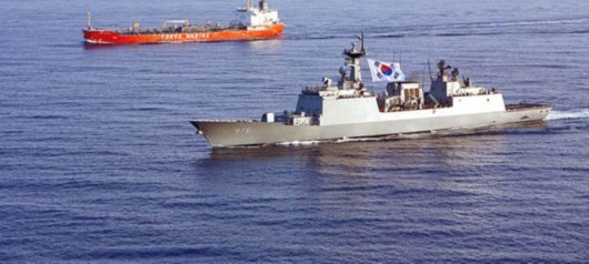 In this file photo a South Korean DDH-975 destroyer escort a cargo ship. In this file photo a South Korean DDH-975 destroyer escort a cargo ship.