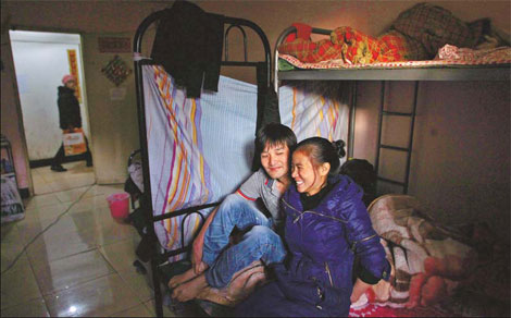 He Quanji and his wife, from Fujian province, get comfortable in their basement in Chaoyang district. He Quanji and his wife, from Fujian province, get comfortable in their basement in Chaoyang district.